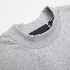 Fear of God Essentials Spelman Arch Letter Mock Neck Loose Short Sleeve T-Shirt